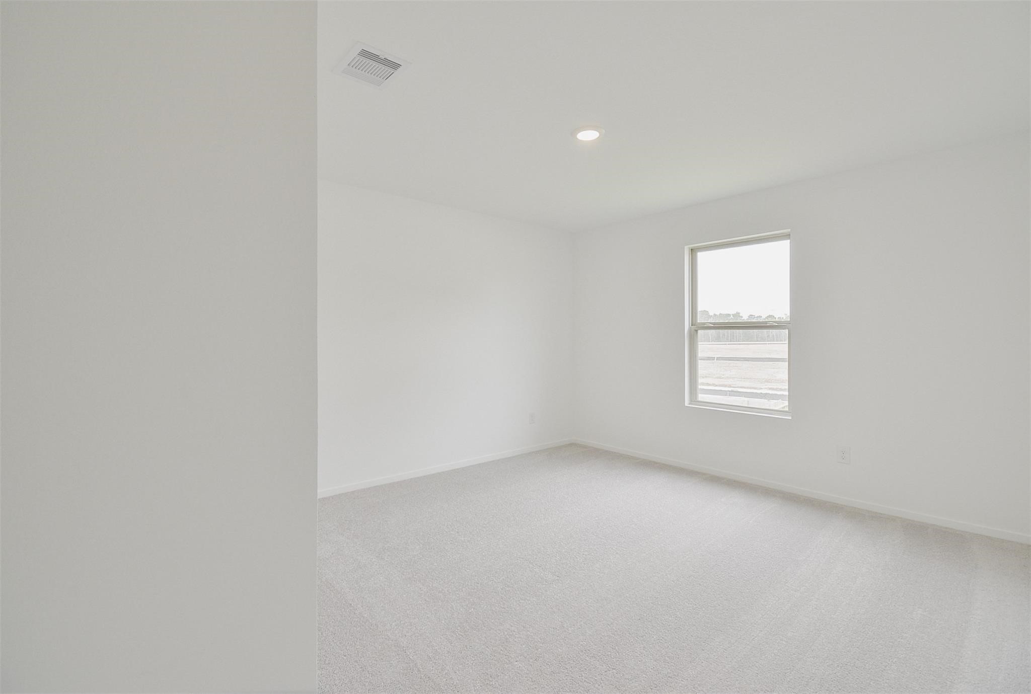 18566 Cepagatti Drive New Caney, TX 77357 - Photo 28 of 35 an empty room with a window