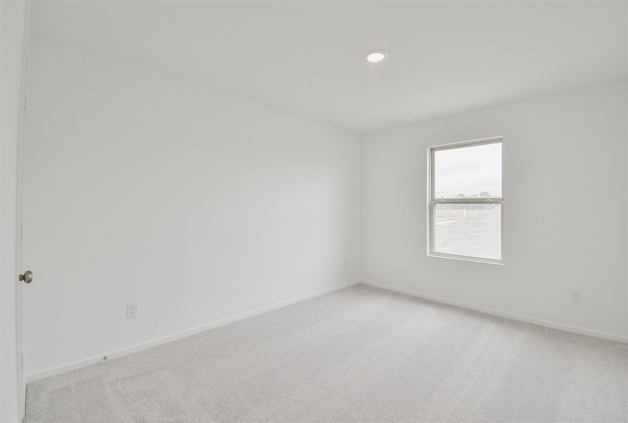 18566 Cepagatti Drive New Caney, TX 77357 - Photo 30 of 35 an empty room with a window