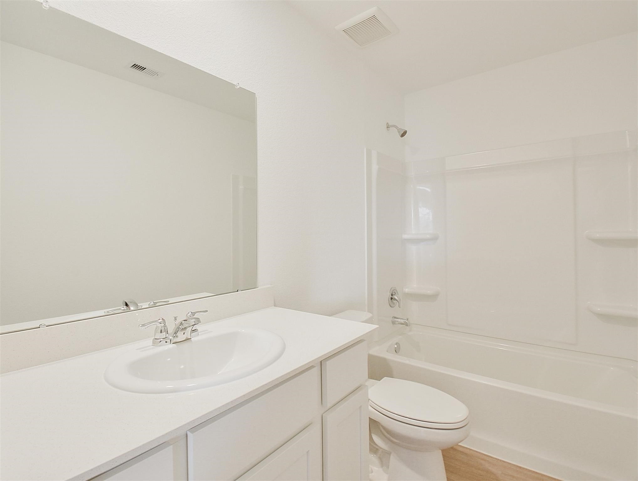 18566 Cepagatti Drive New Caney, TX 77357 - Photo 33 of 35 a bathroom with a sink toilet and shower