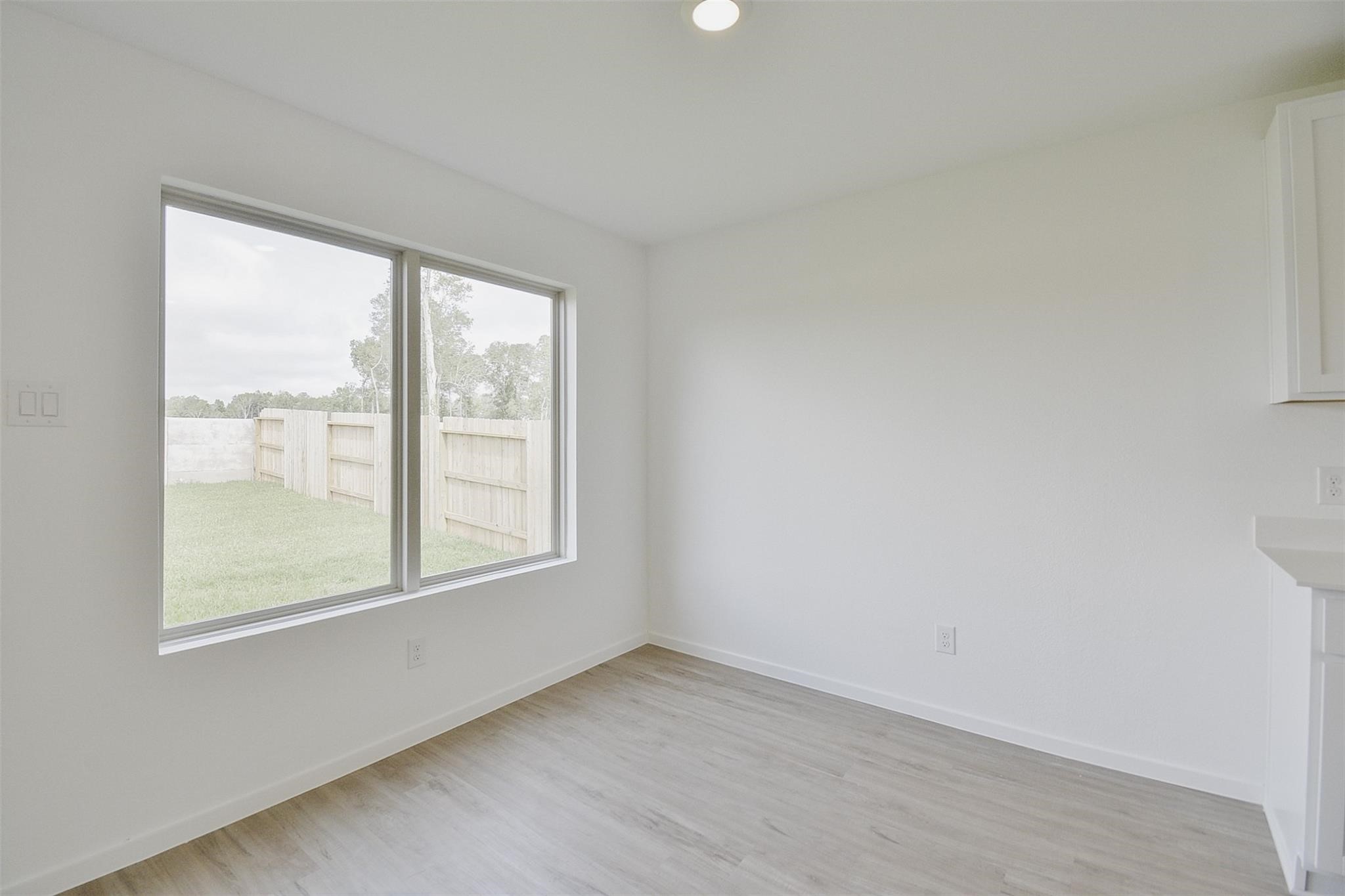 18566 Cepagatti Drive New Caney, TX 77357 - Photo 7 of 35 an empty room with a window