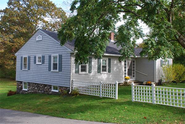 93 Argilla Road Andover, MA 01810 - Photo 1 of 28 a front view of a house with a garden and yard
