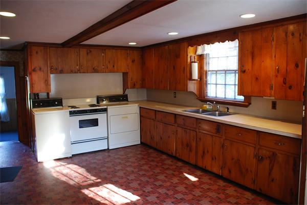 93 Argilla Road Andover, MA 01810 - Photo 14 of 28 a kitchen with a sink stove and cabinets