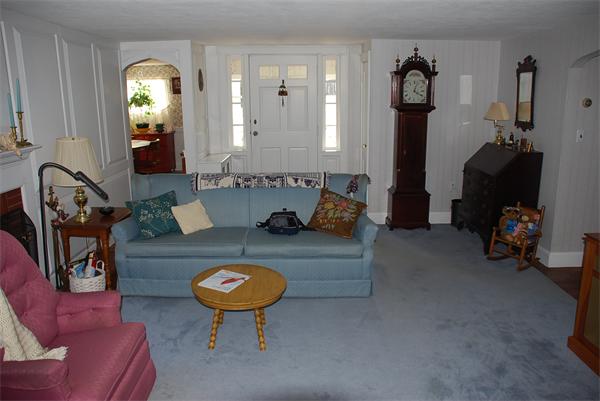 93 Argilla Road Andover, MA 01810 - Photo 15 of 28 a living room with furniture and a lamp