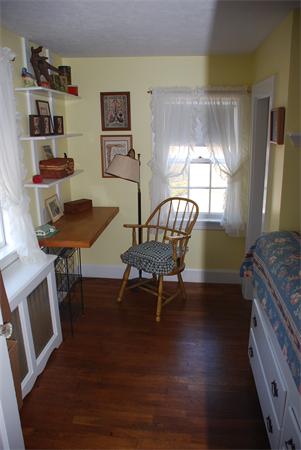 93 Argilla Road Andover, MA 01810 - Photo 8 of 28 a living room with furniture and a wooden floor