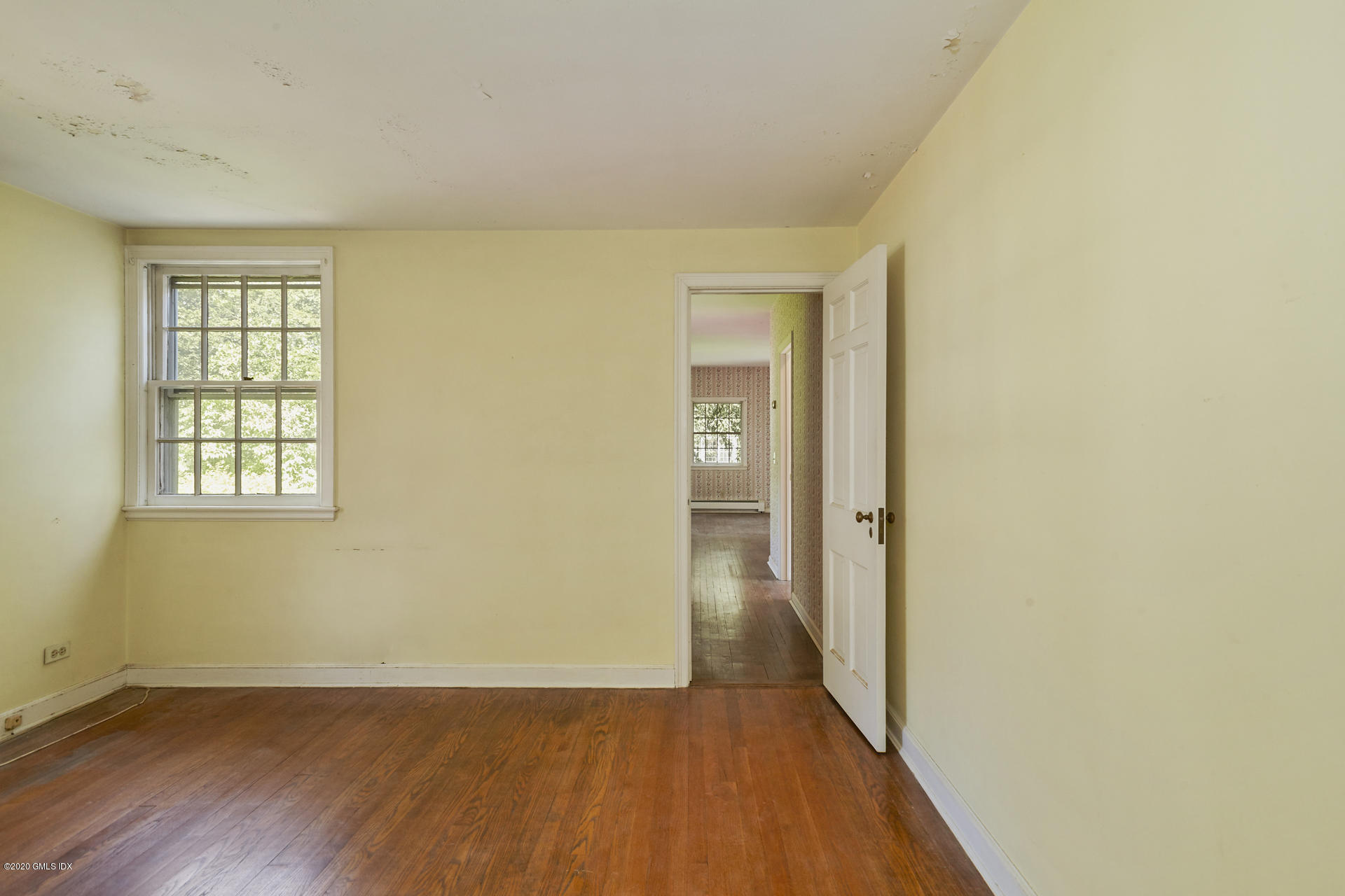 10 Hendrie Lane Riverside, CT 06878 - Photo 12 of 28 an empty room with wooden floor and windows