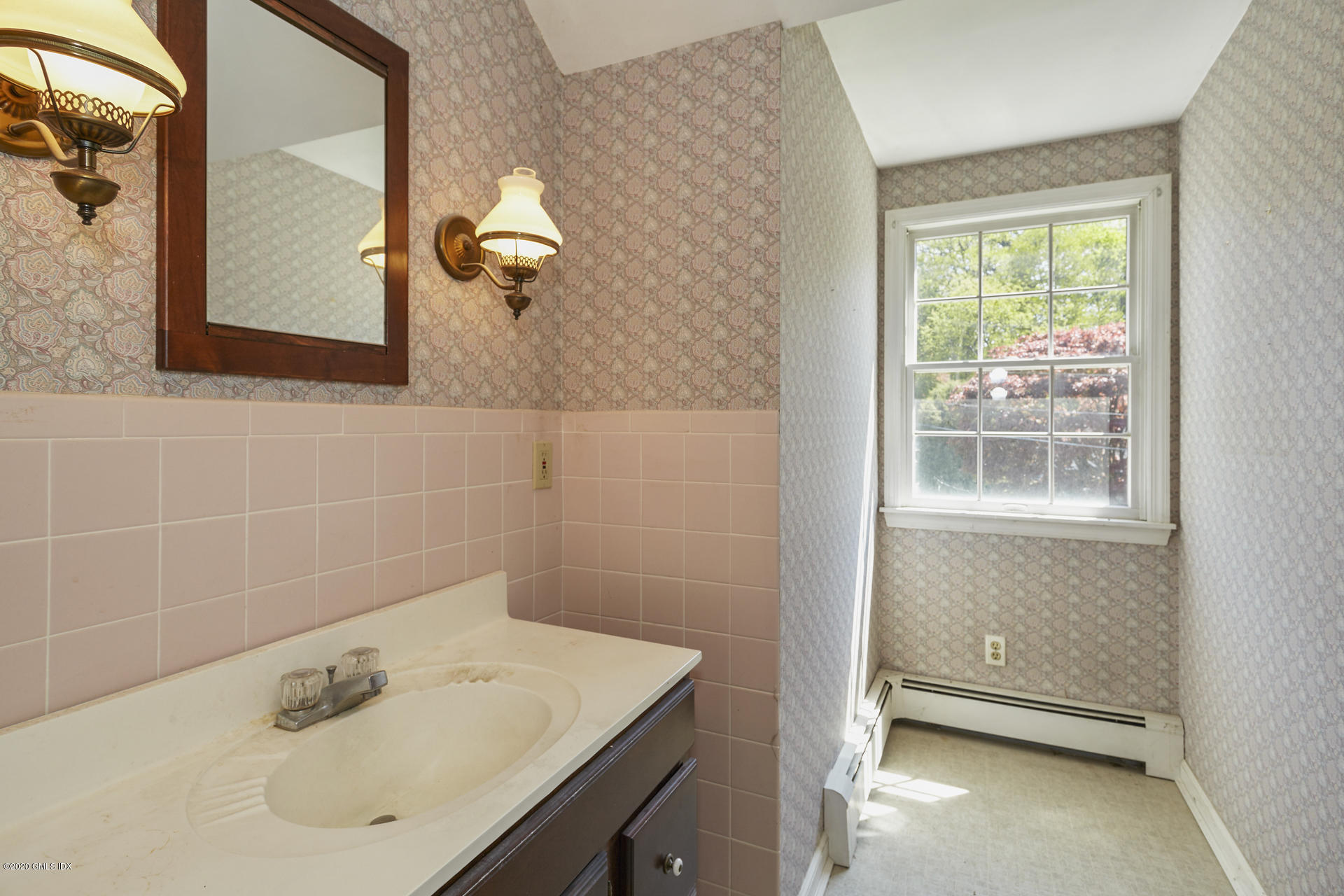 10 Hendrie Lane Riverside, CT 06878 - Photo 15 of 28 a bathroom with a sink and a mirror