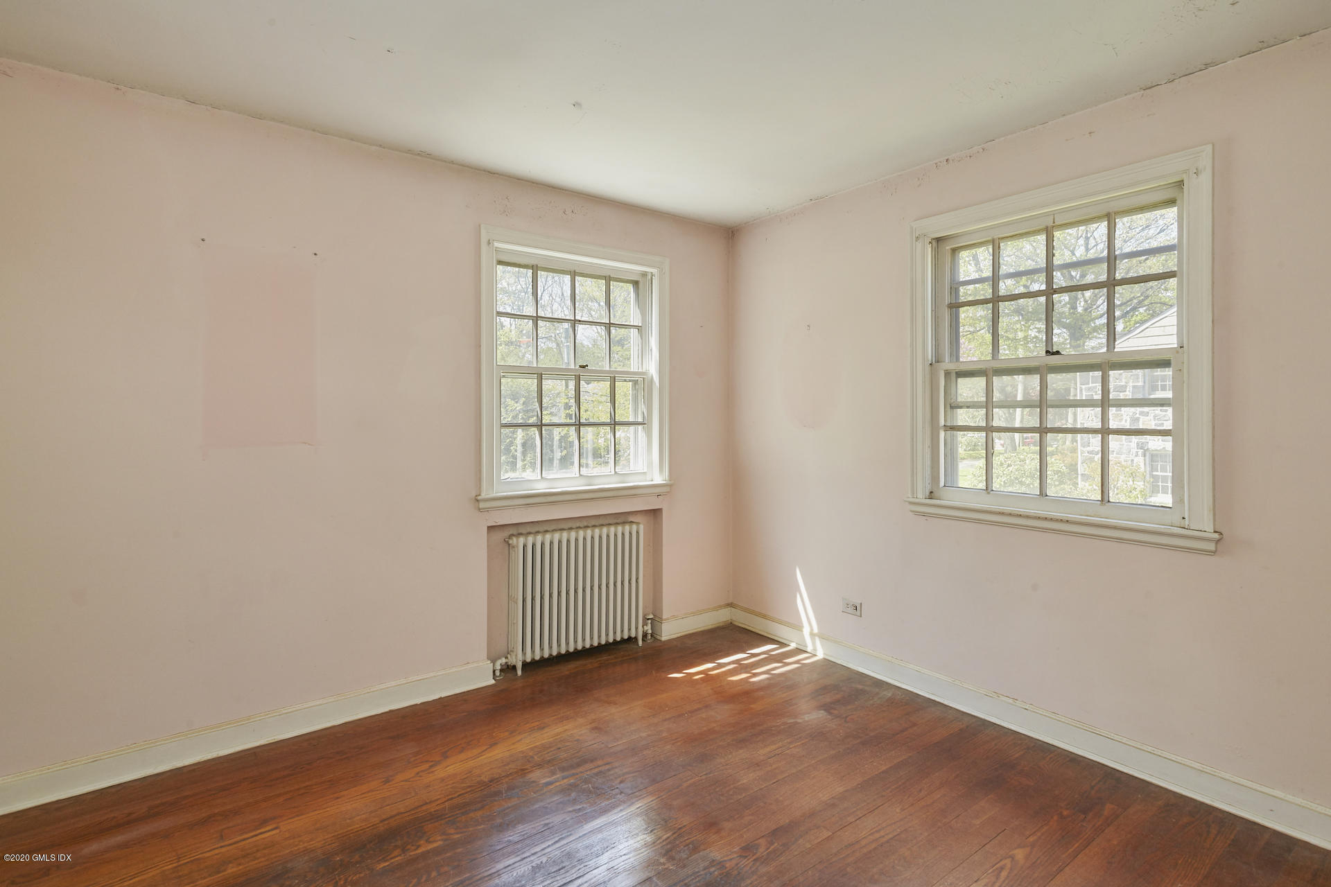 10 Hendrie Lane Riverside, CT 06878 - Photo 17 of 28 an empty room with wooden floor and windows