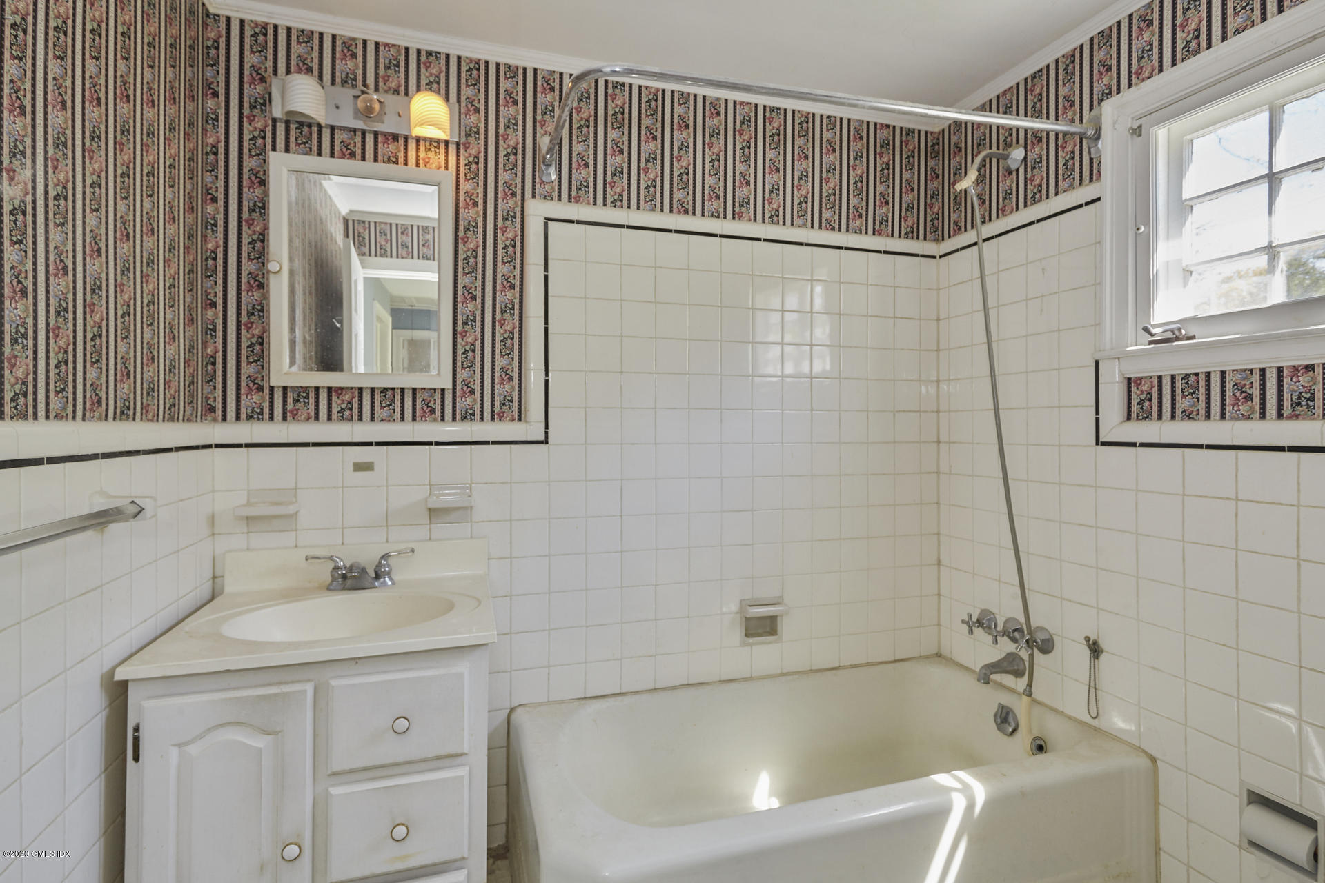 10 Hendrie Lane Riverside, CT 06878 - Photo 18 of 28 a bathroom with a sink a mirror and a shower