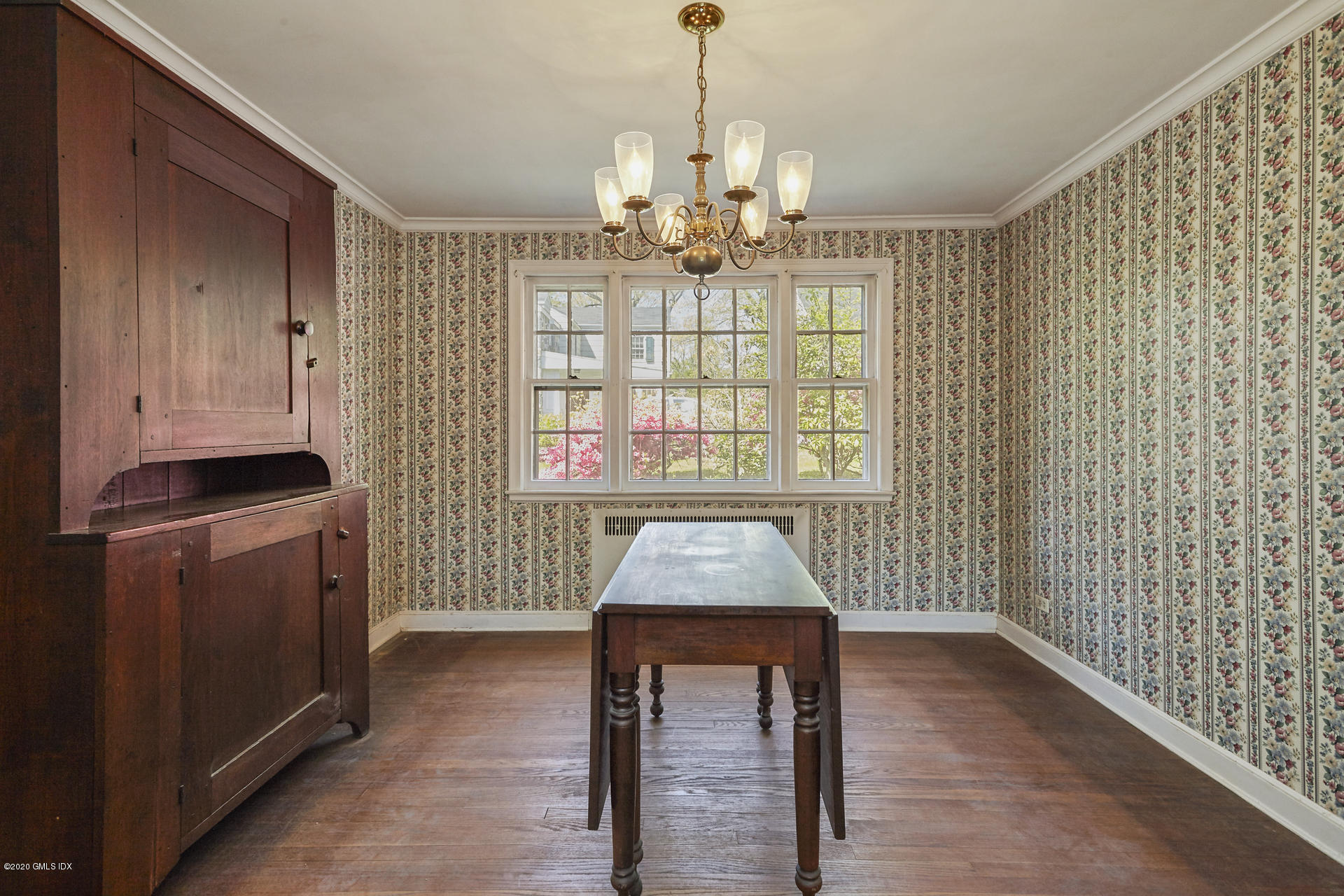 10 Hendrie Lane Riverside, CT 06878 - Photo 4 of 28 a dining room with furniture and chandelier