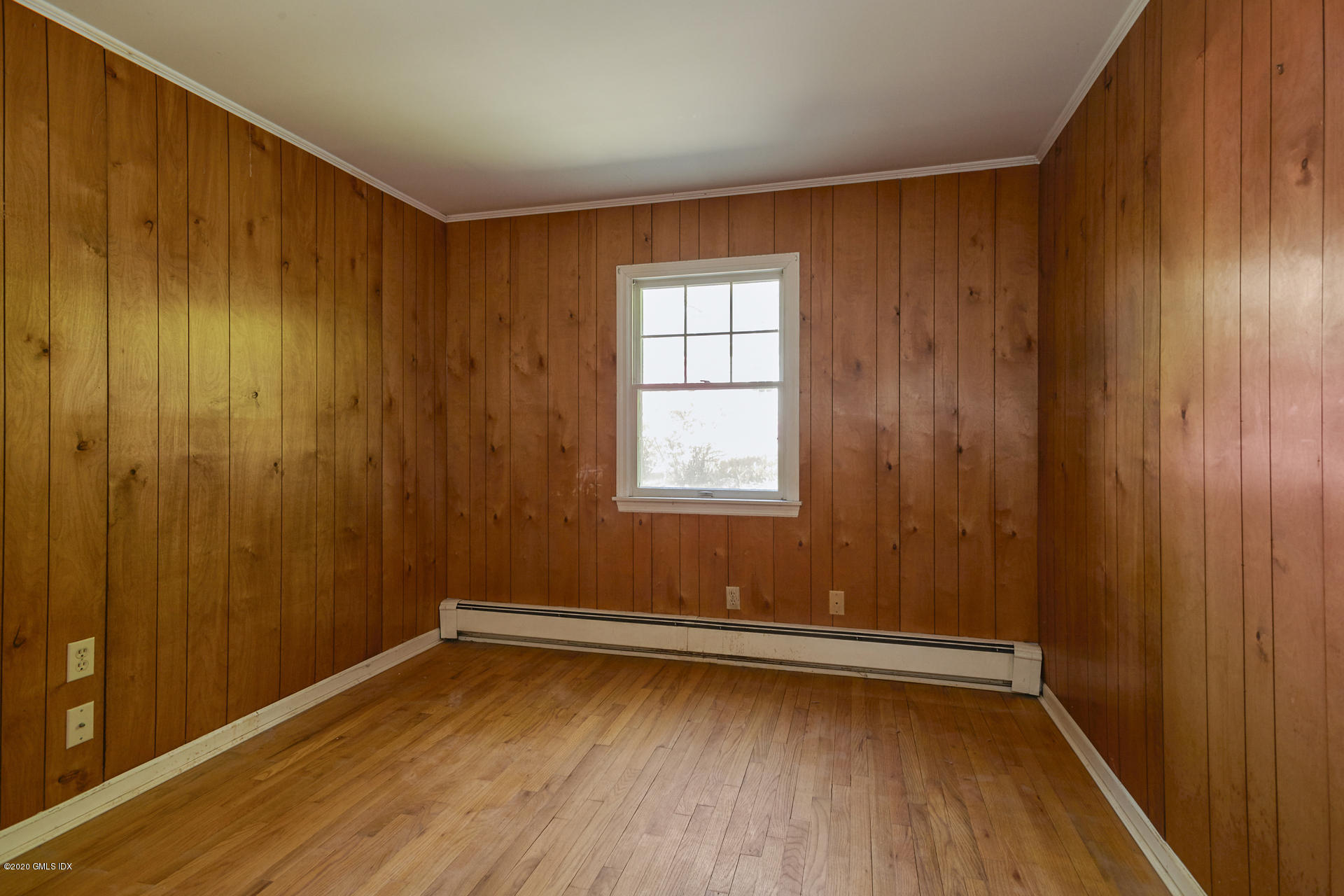 10 Hendrie Lane Riverside, CT 06878 - Photo 9 of 28 an empty room with wooden floor and windows