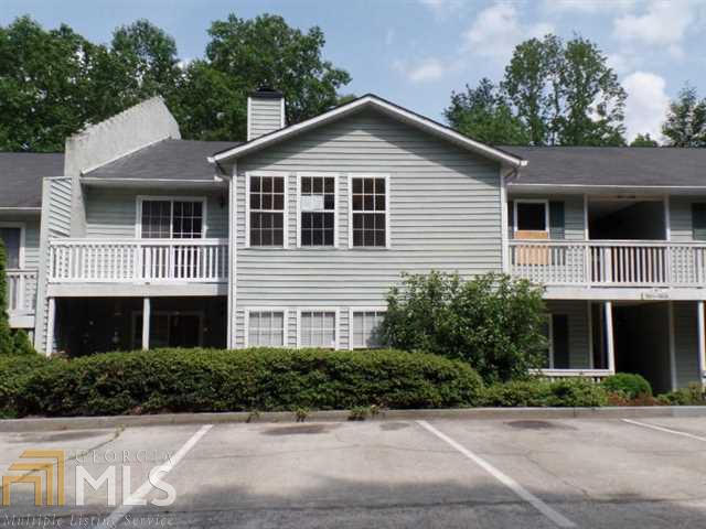 1907 Brian Way Decatur, GA 30033 - Photo 1 of 1 a front view of a house with a yard and garage