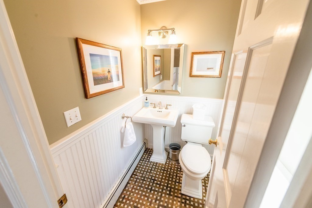 71 Waldeck Road Milton, MA 02186 - Photo 12 of 27 a bathroom with a sink and a mirror