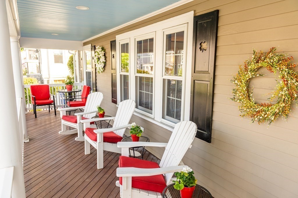71 Waldeck Road Milton, MA 02186 - Photo 2 of 27 a living room with furniture and floor to ceiling windows