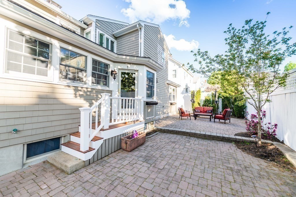 71 Waldeck Road Milton, MA 02186 - Photo 25 of 27 a view of a house with a cars park side of a road