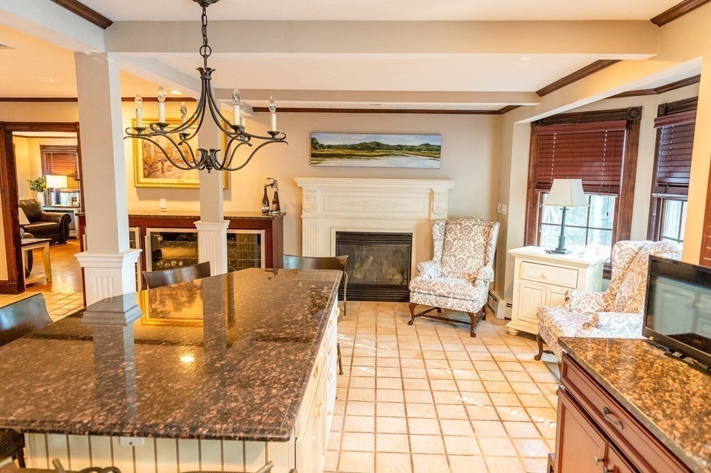 71 Waldeck Road Milton, MA 02186 - Photo 7 of 27 a living room with fireplace furniture and a fireplace