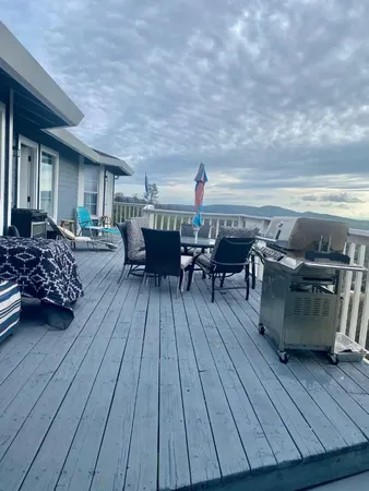 a view of walk in closet with wooden floor