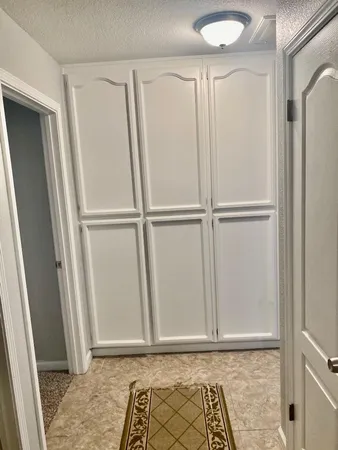a kitchen with a stove a sink and a refrigerator