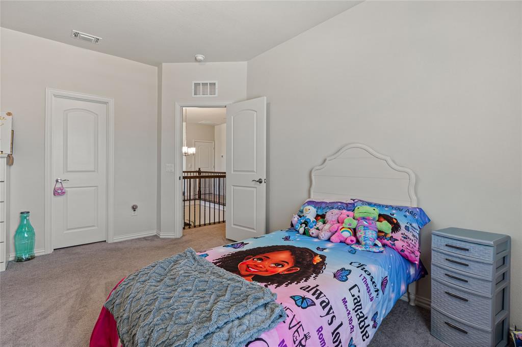 9517 Sunset Lane Oak Point, TX 75068 - Photo 32 of 40 9517 Sunset Lane, Oak Point, TX 75068 - bedroo - Bedroom featuring light colored carpet