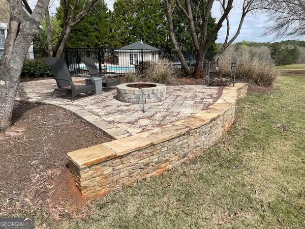 a view of barbeque grill and wooden floor