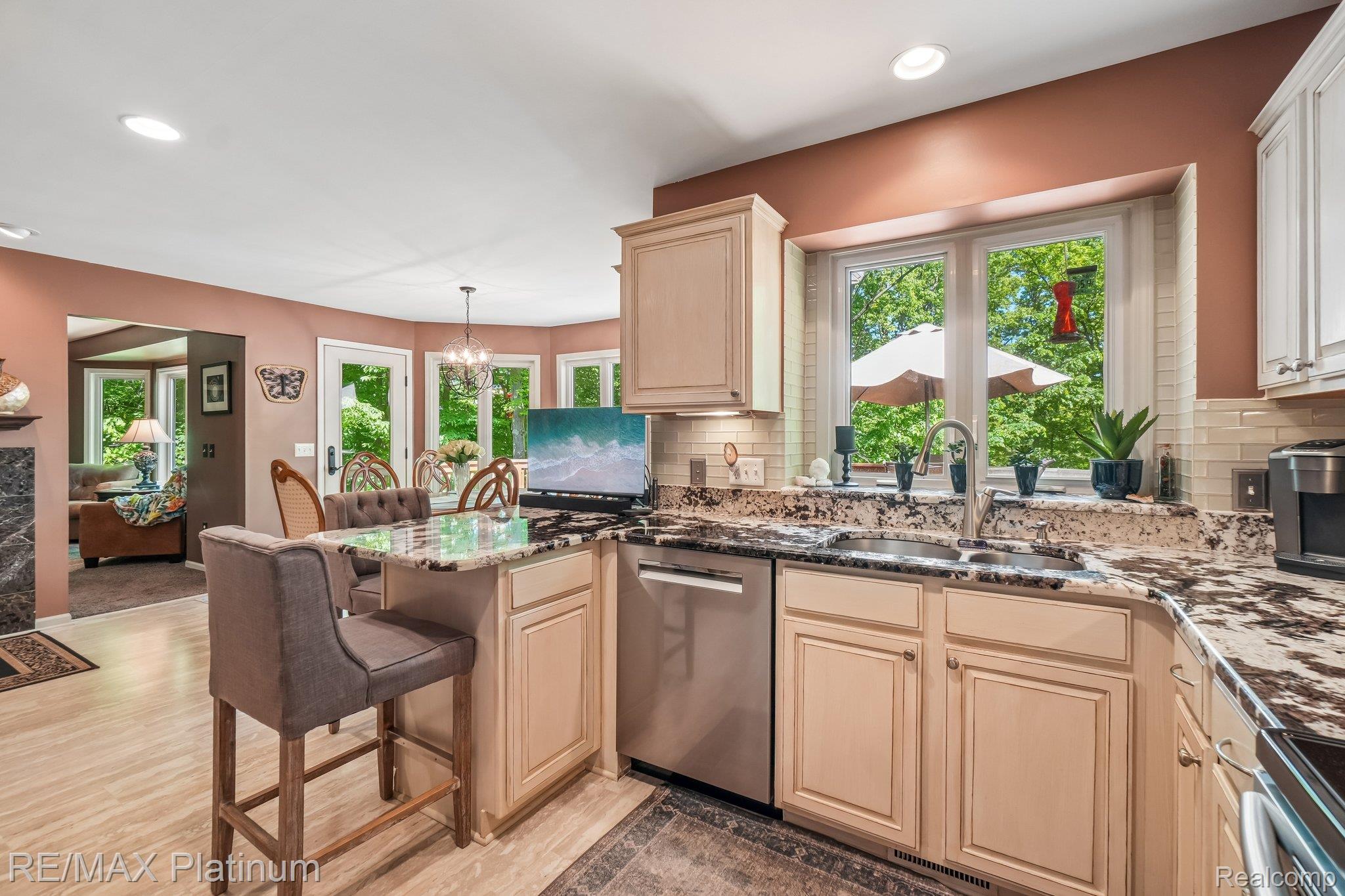 2260 Moorland's View Howell, MI 48855 - Photo 13 of 40 Kitchen featuring light wood-finish cabinetry, granite countertops, and stainless steel appliances