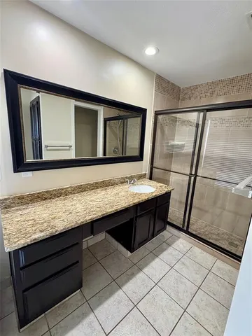 a bathroom with a sink a vanity and mirror