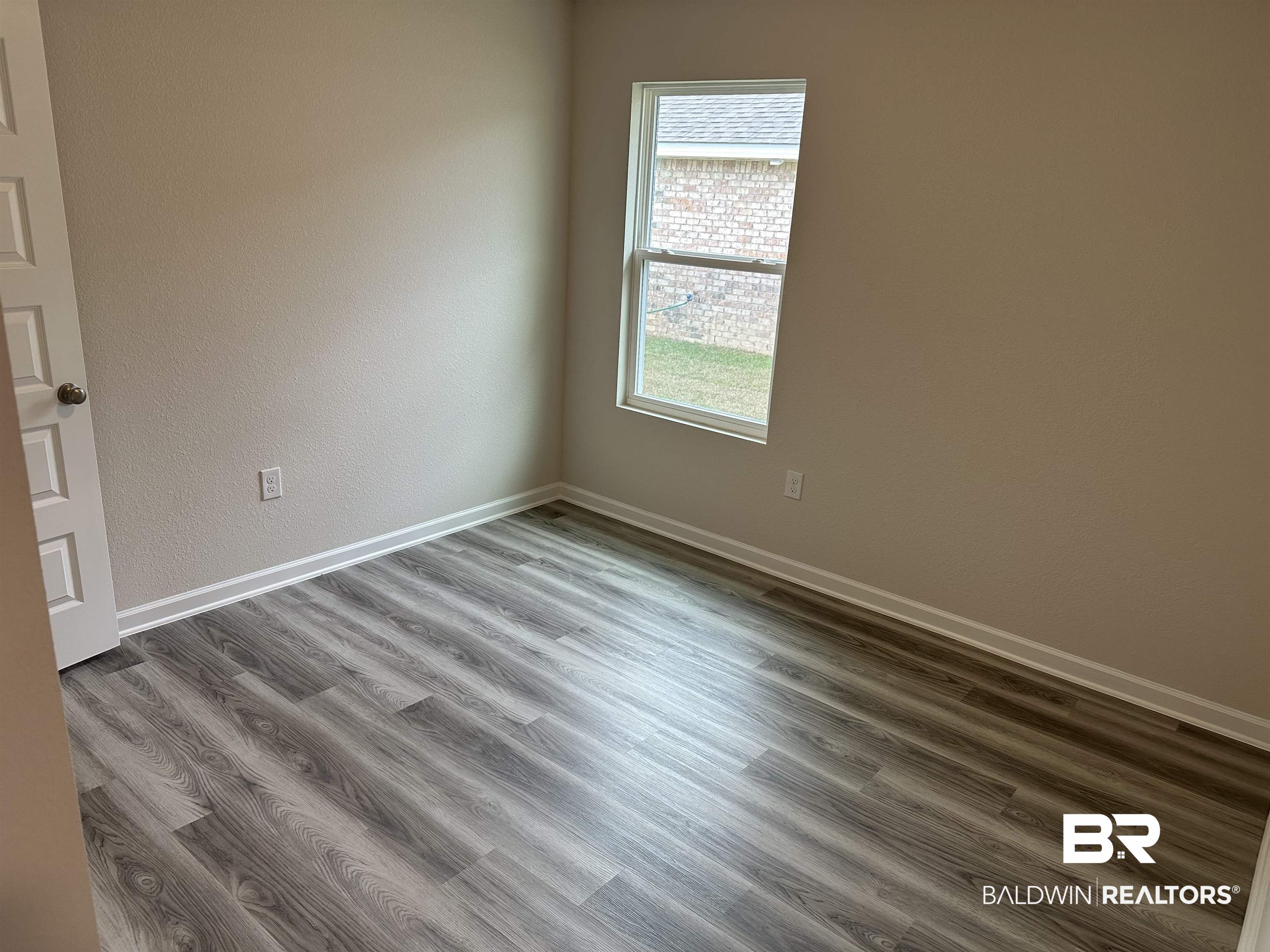 1238 Hayward Loop Foley, AL 36535 - Photo 12 of 46 Unfurnished room with hardwood / wood-style flooring