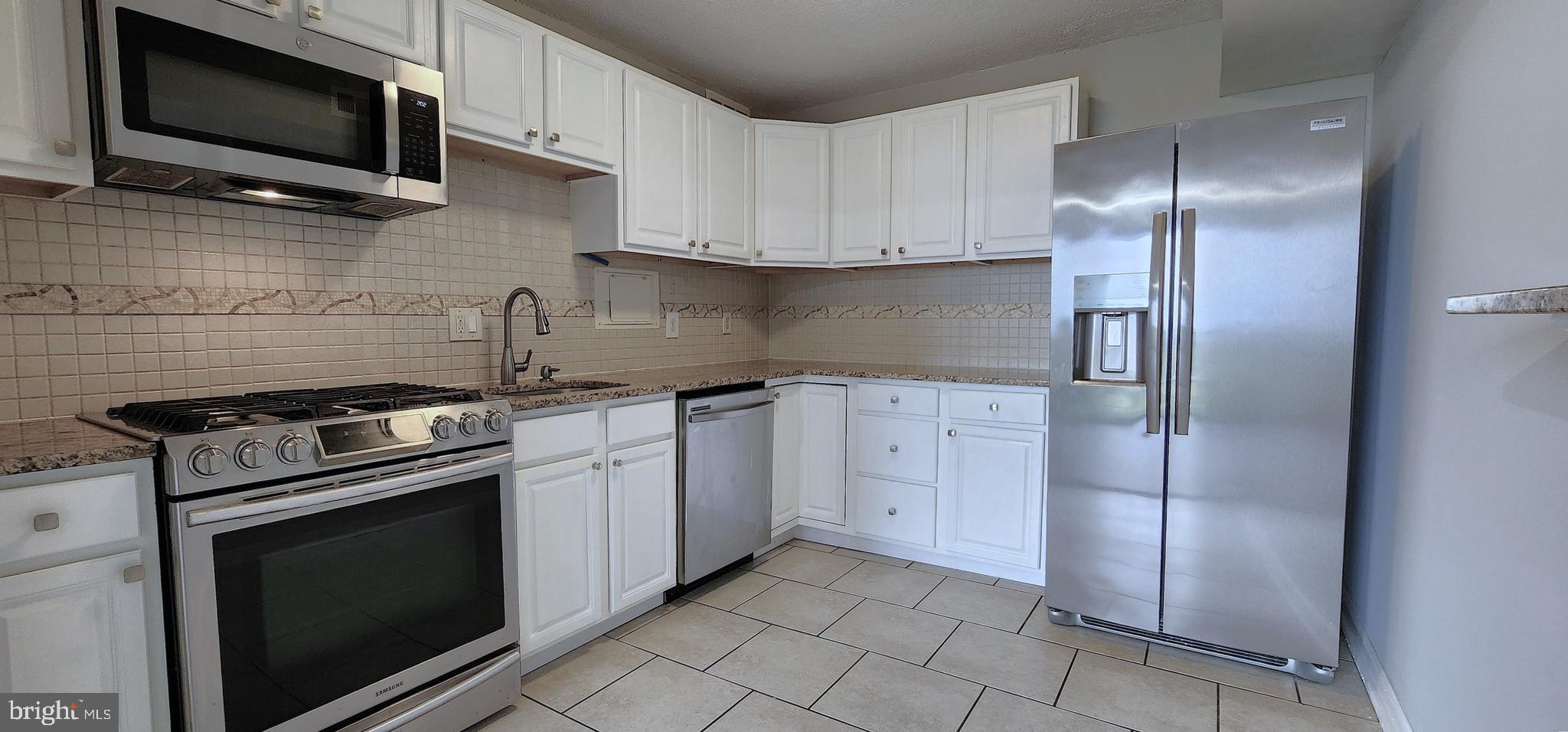 1836 Metzerott Road, Unit 1710 Adelphi, MD 20783 - Photo 8 of 33 Kitchen w/Granite C-tops & SS Appliances