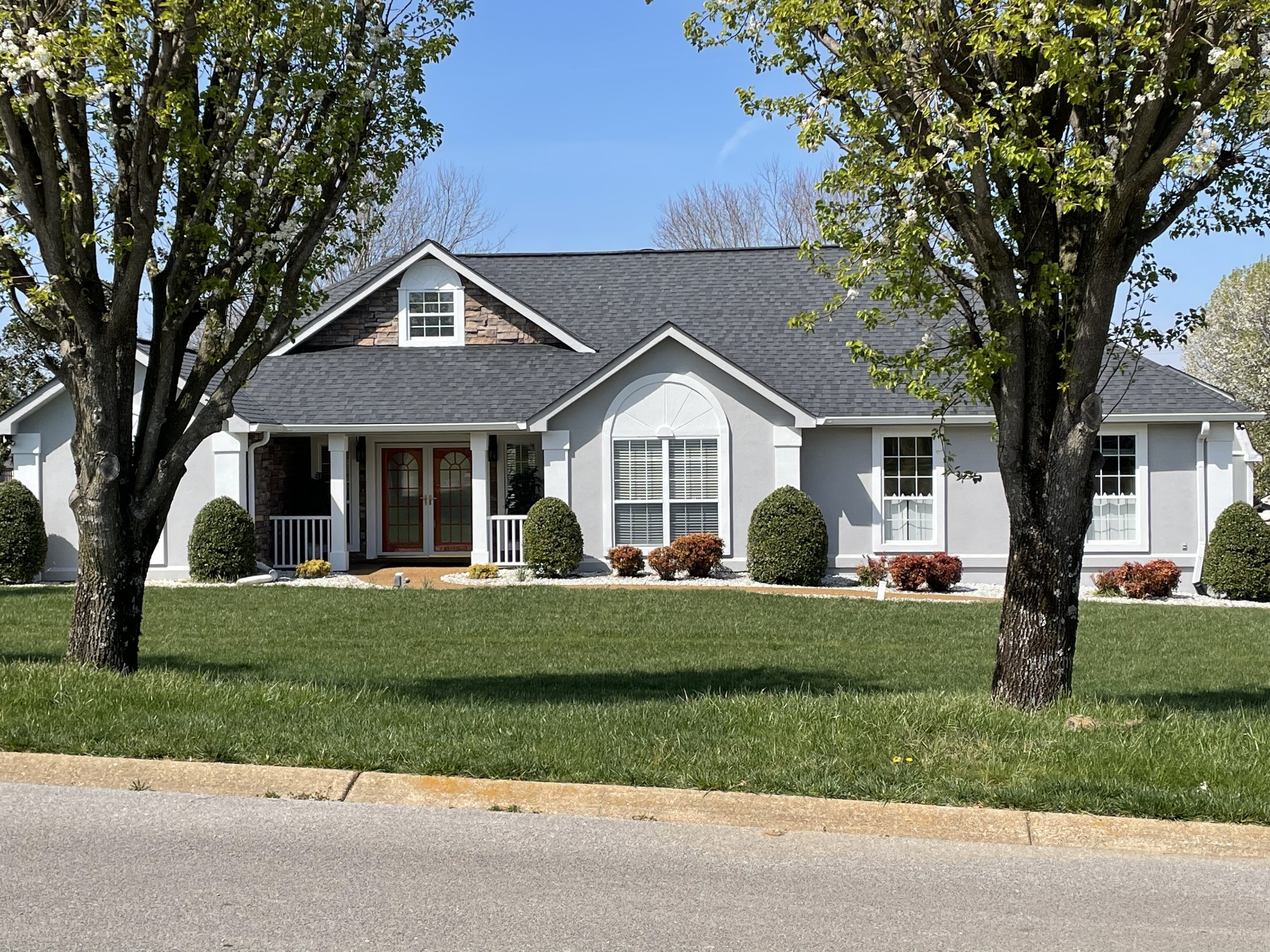 1243 Hunters Point Lane Spring Hill, TN 37174 - Photo 1 of 35 a front view of a house with a yard
