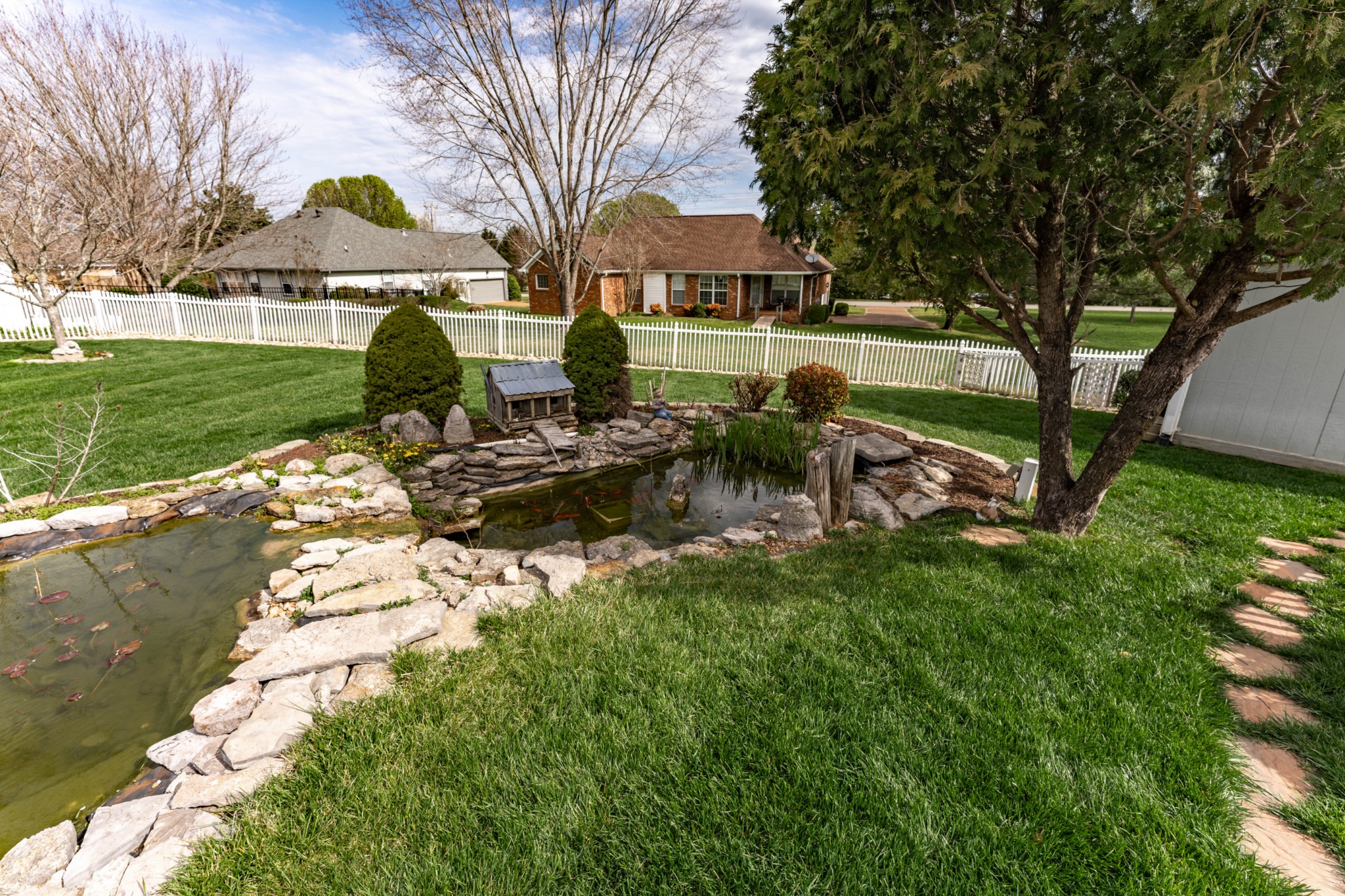 1243 Hunters Point Lane Spring Hill, TN 37174 - Photo 12 of 35 a view of a house with a yard