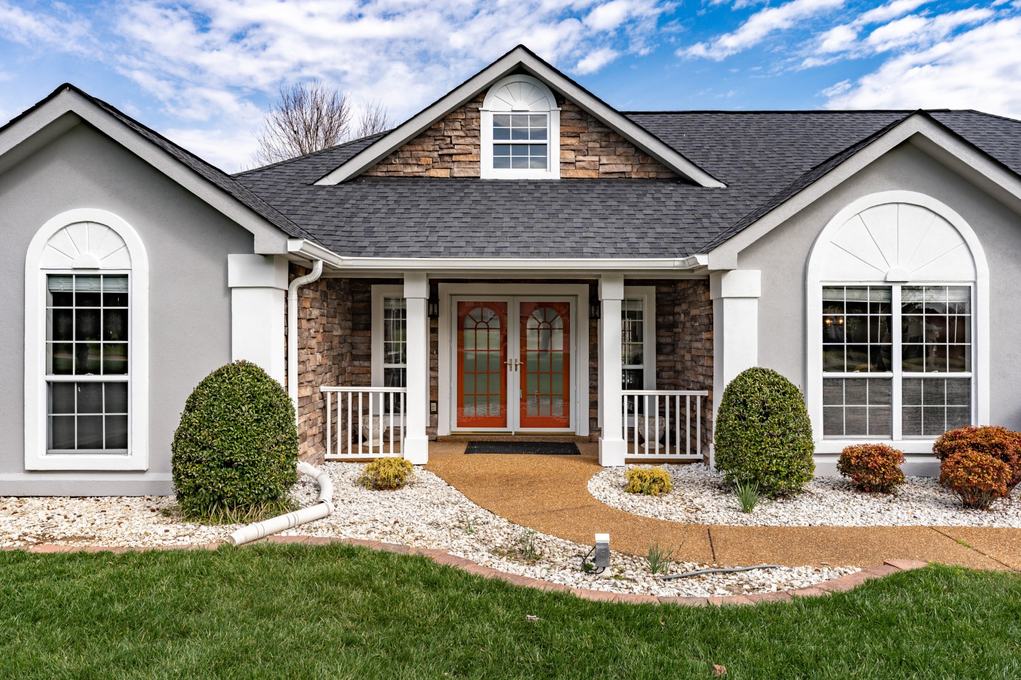 1243 Hunters Point Lane Spring Hill, TN 37174 - Photo 17 of 35 a front view of a house with a garden