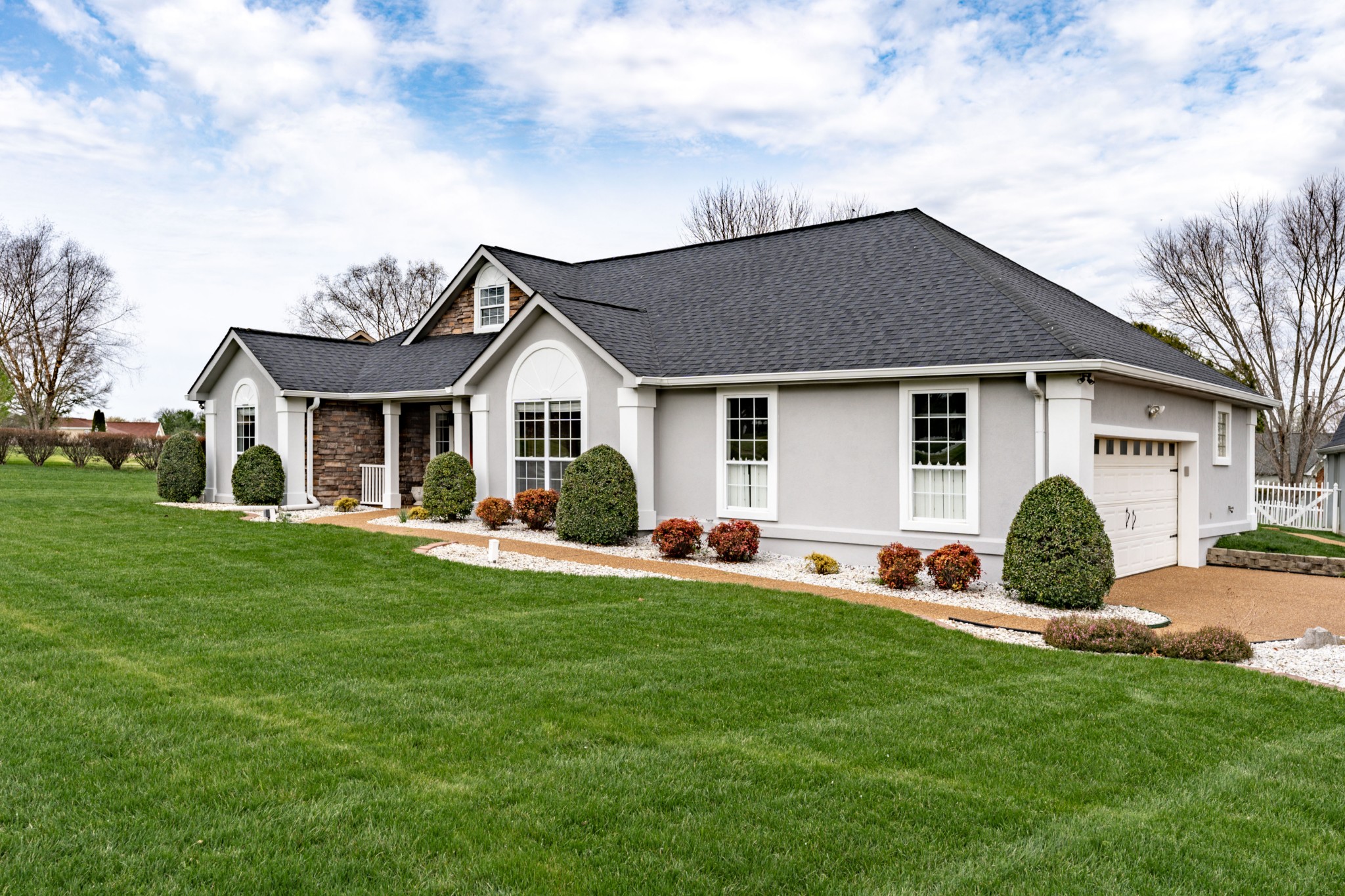1243 Hunters Point Lane Spring Hill, TN 37174 - Photo 2 of 35 a front view of house with a garden and yard