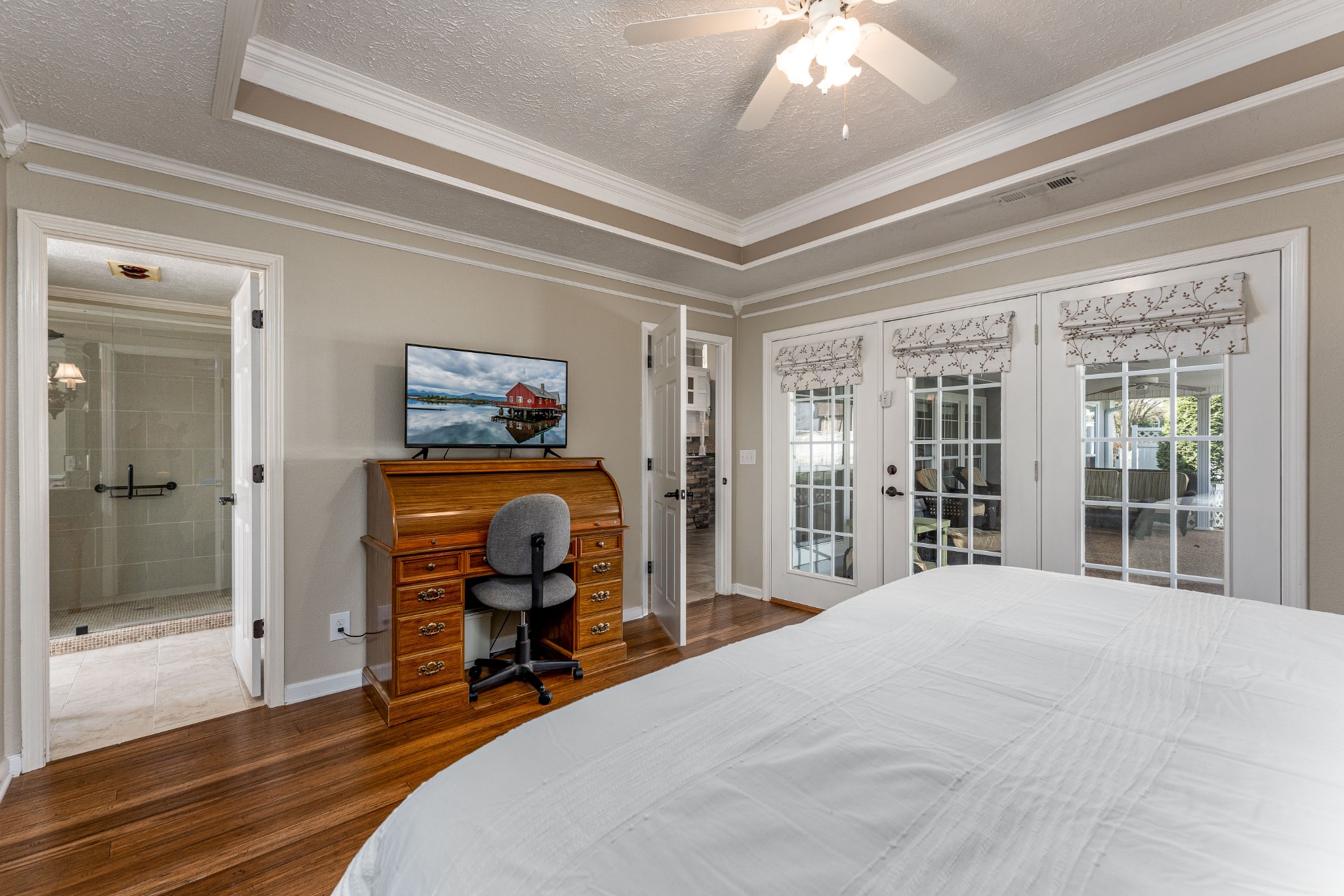 1243 Hunters Point Lane Spring Hill, TN 37174 - Photo 30 of 35 a bedroom with a bed and a chandelier
