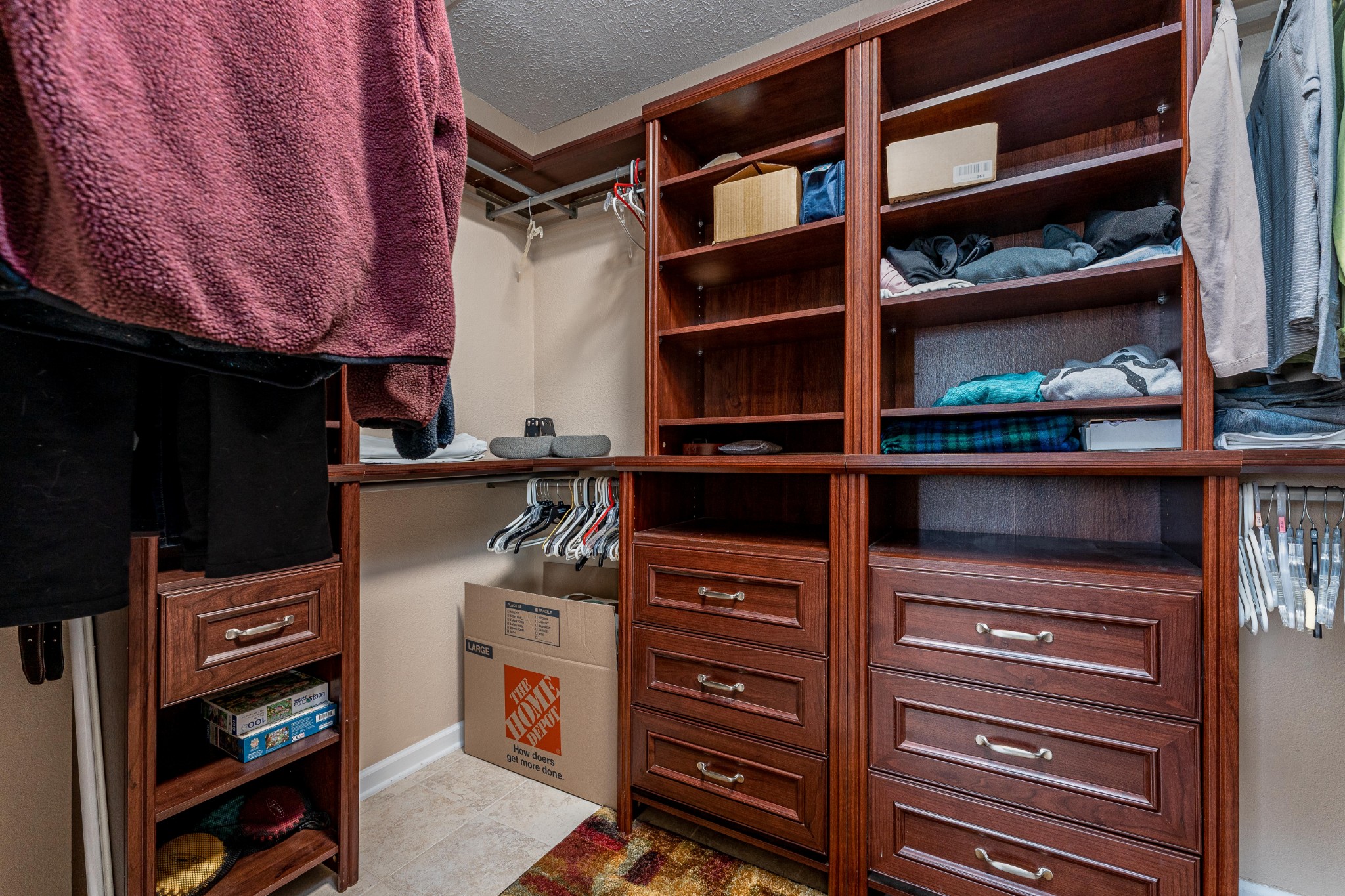 1243 Hunters Point Lane Spring Hill, TN 37174 - Photo 33 of 35 a view of walk in closet with clothes and shoes