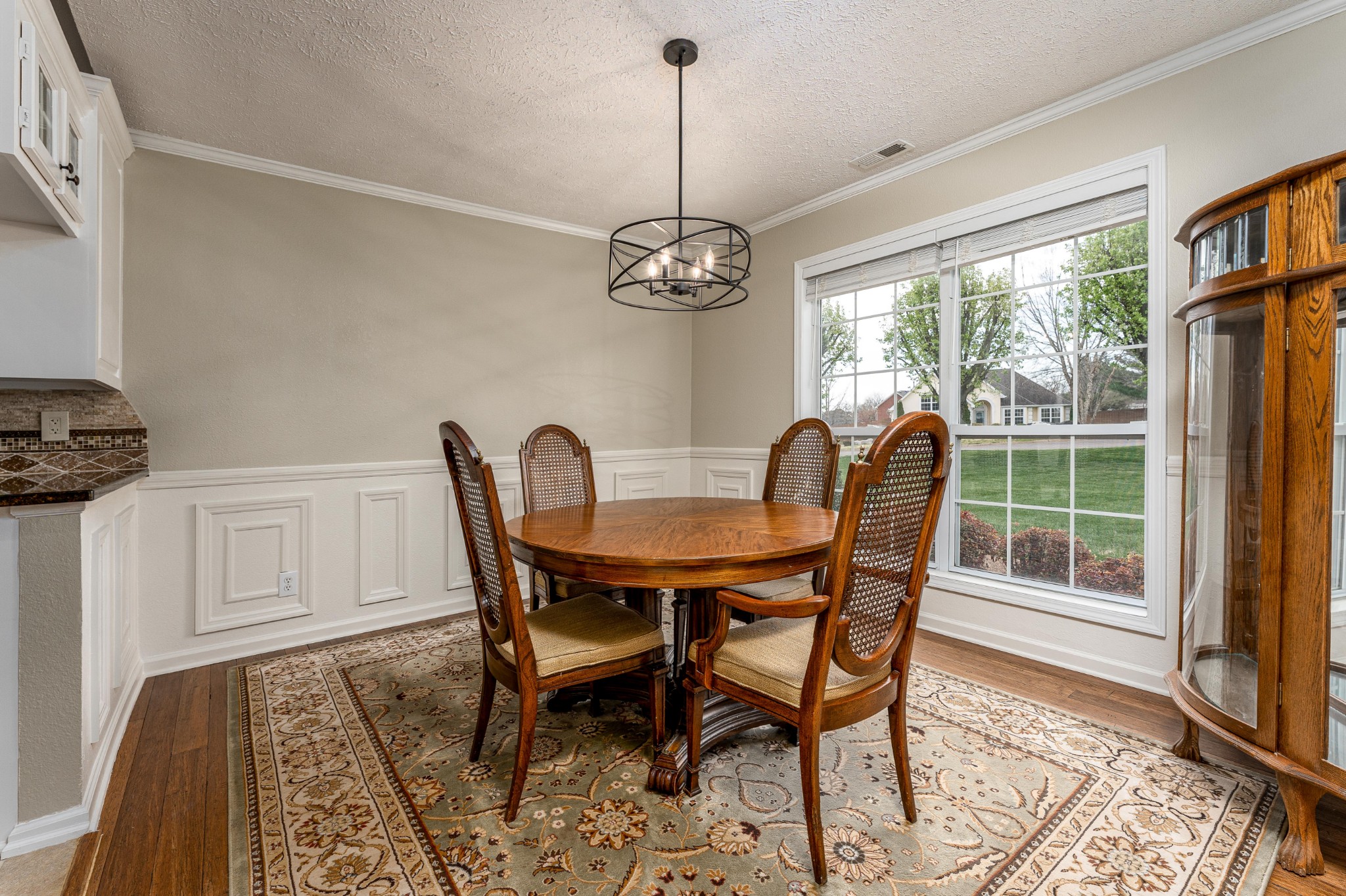 1243 Hunters Point Lane Spring Hill, TN 37174 - Photo 35 of 35 a dining room with furniture a chandelier and wooden floor