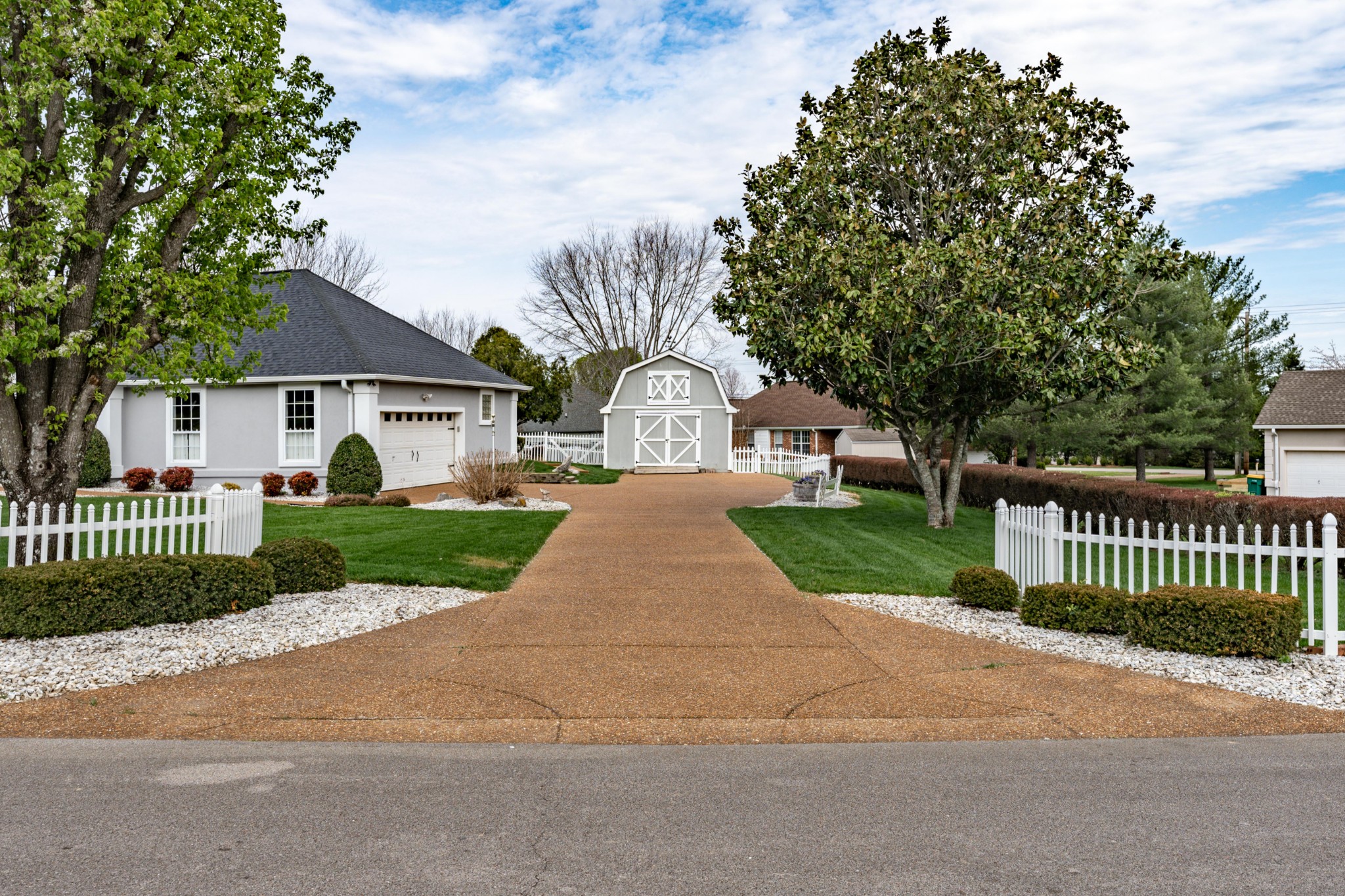 1243 Hunters Point Lane Spring Hill, TN 37174 - Photo 5 of 35 a front view of a house with garden