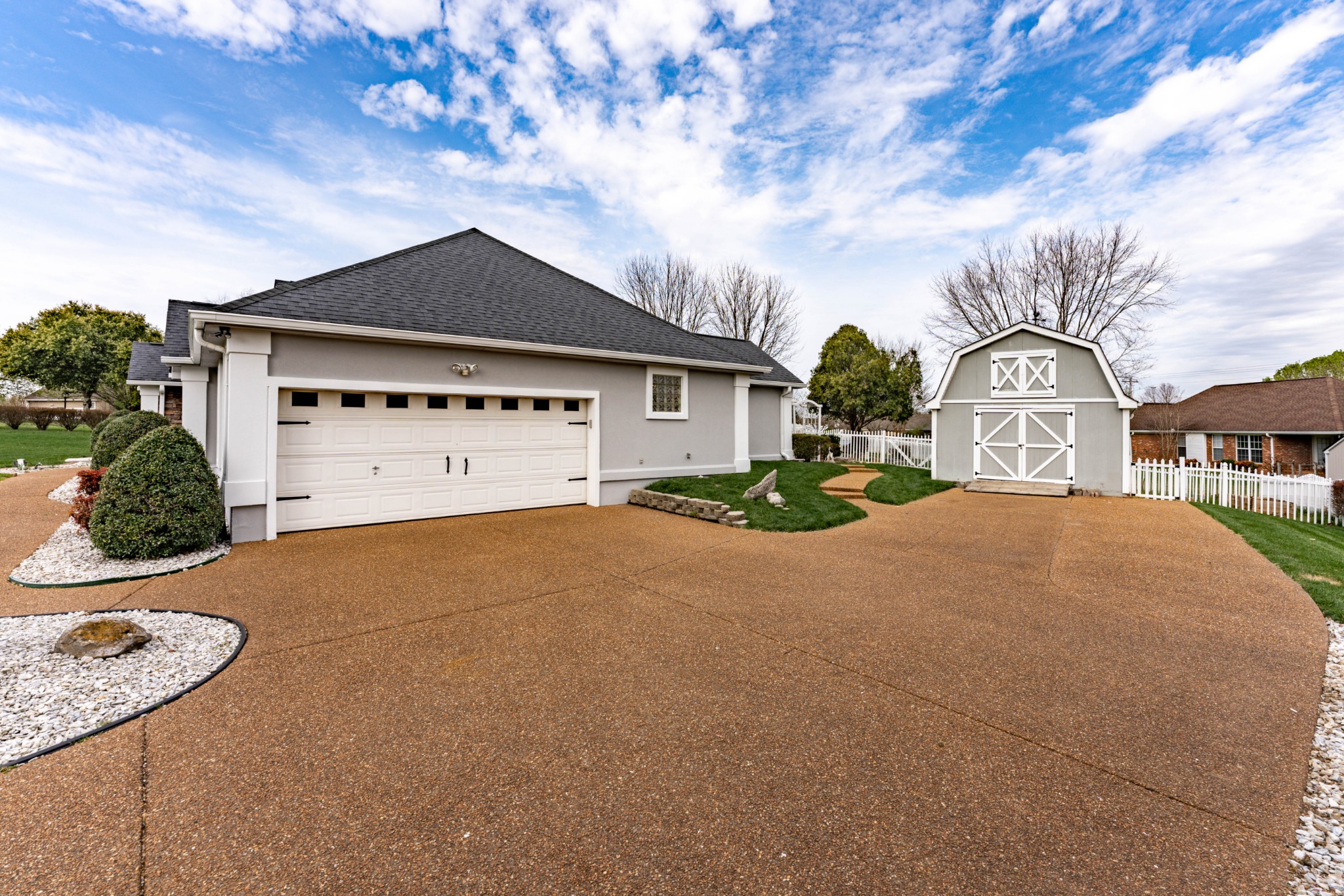 1243 Hunters Point Lane Spring Hill, TN 37174 - Photo 6 of 35 a front view of a house with a yard and garage