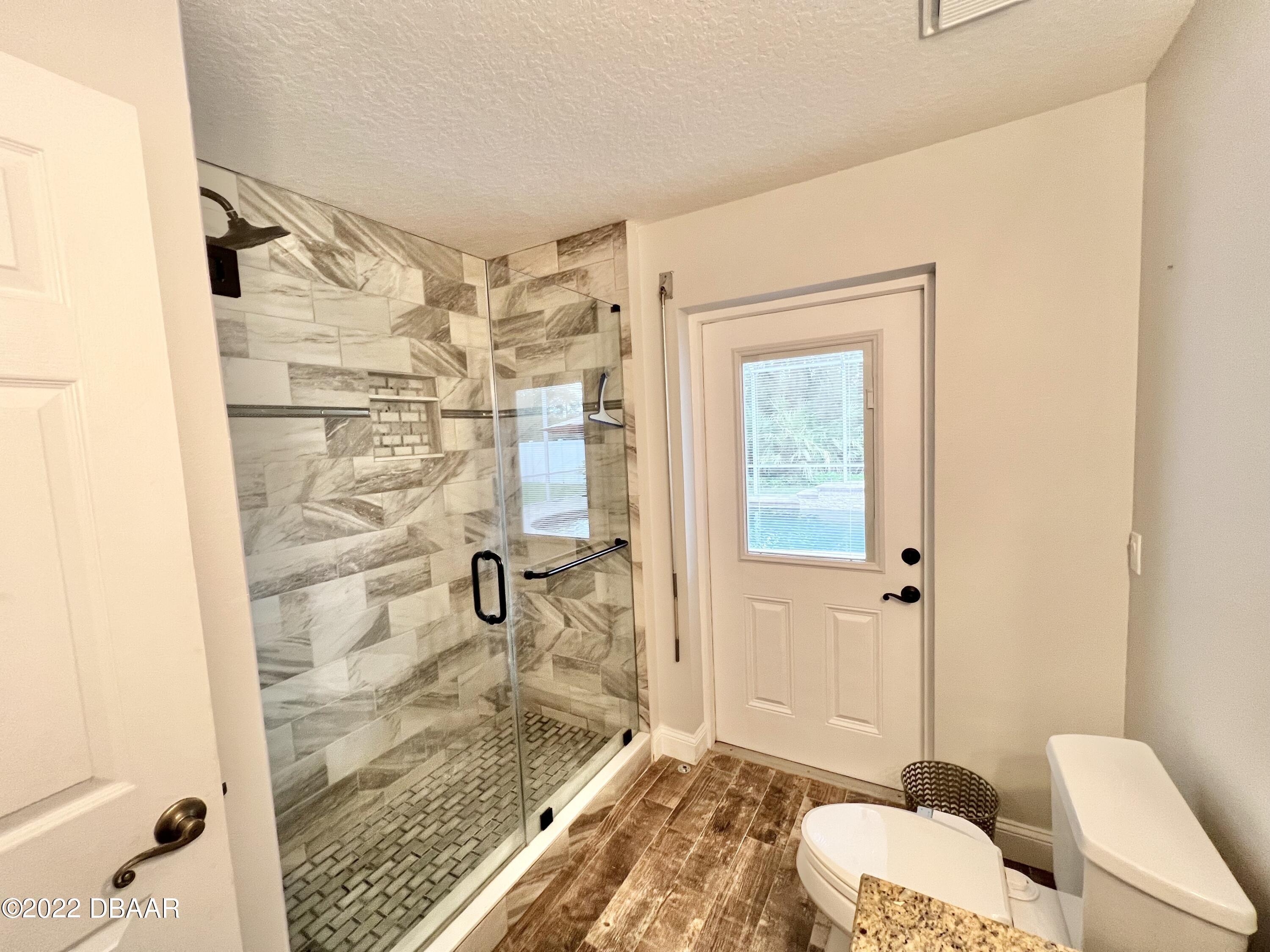 75 Creek Bluff Way Ormond Beach, FL 32174 - Photo 15 of 20 a bathroom with a shower