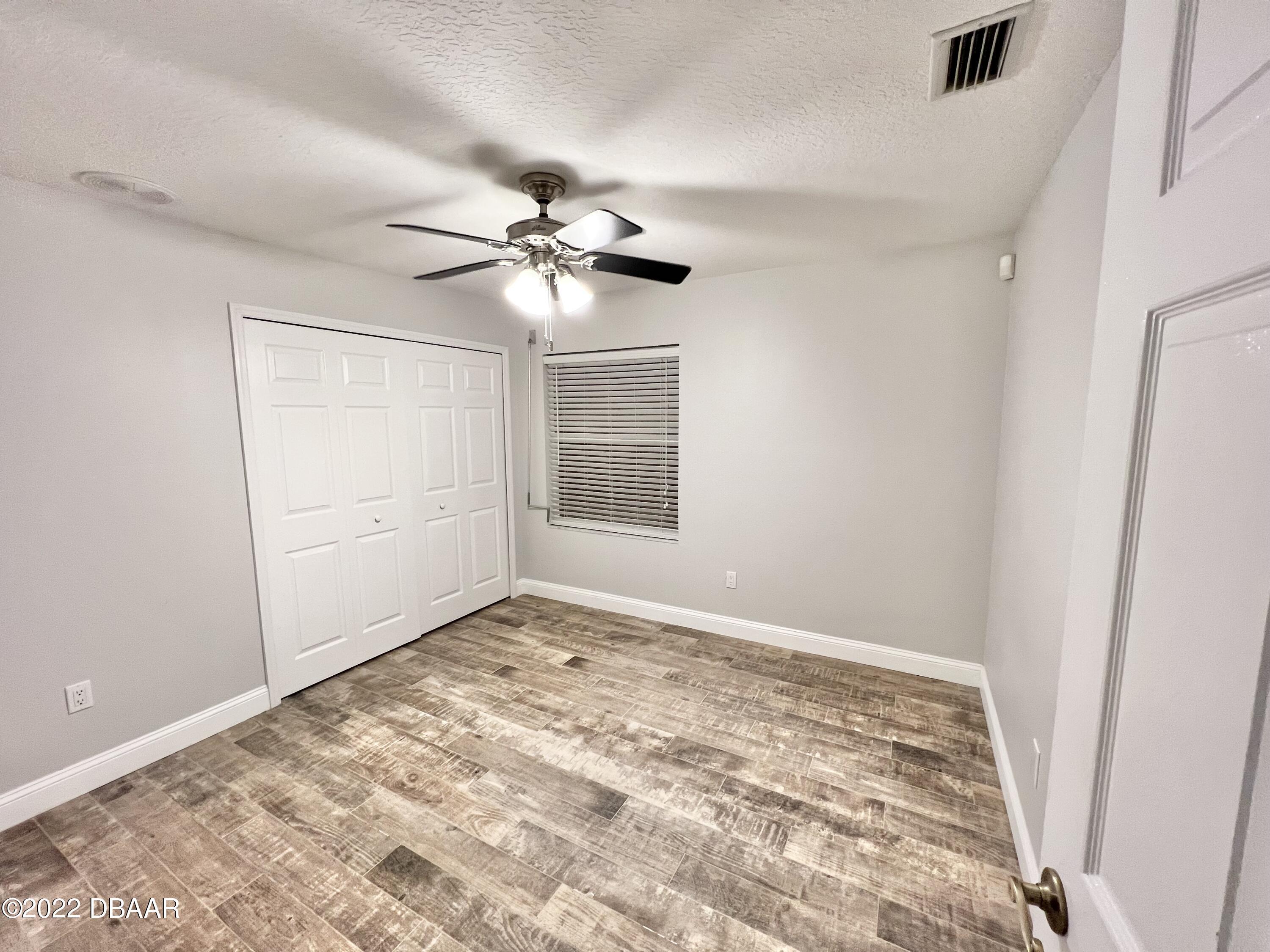 75 Creek Bluff Way Ormond Beach, FL 32174 - Photo 17 of 20 a view of an empty room with a window