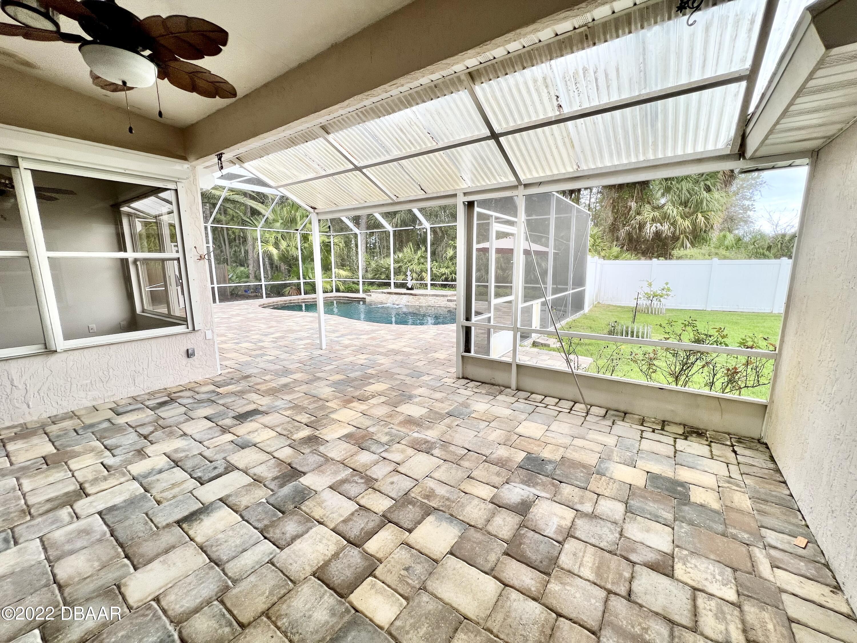 75 Creek Bluff Way Ormond Beach, FL 32174 - Photo 18 of 20 a view of empty room with wooden floor and fan