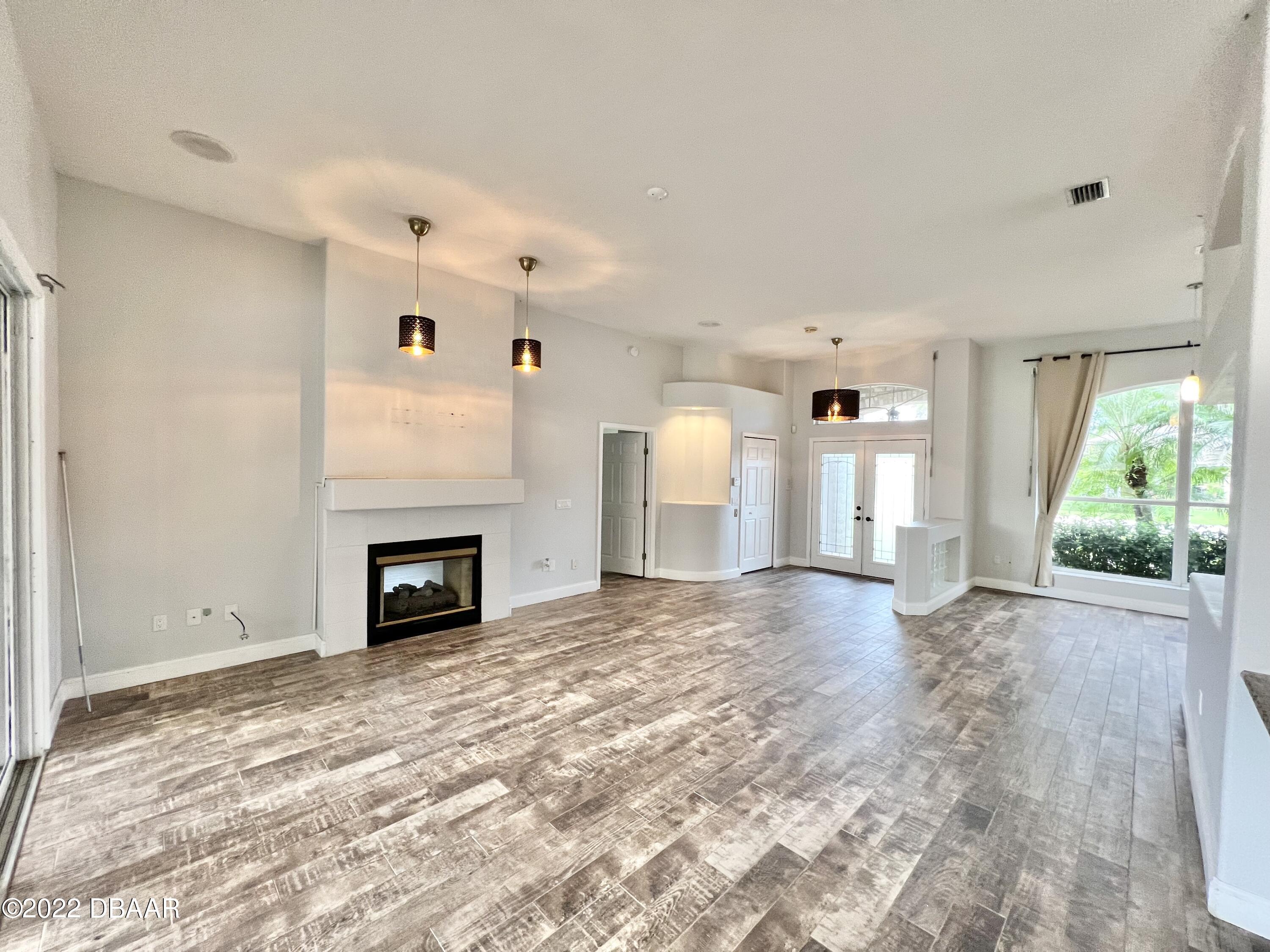 75 Creek Bluff Way Ormond Beach, FL 32174 - Photo 4 of 20 a view of a livingroom with a fireplace and window