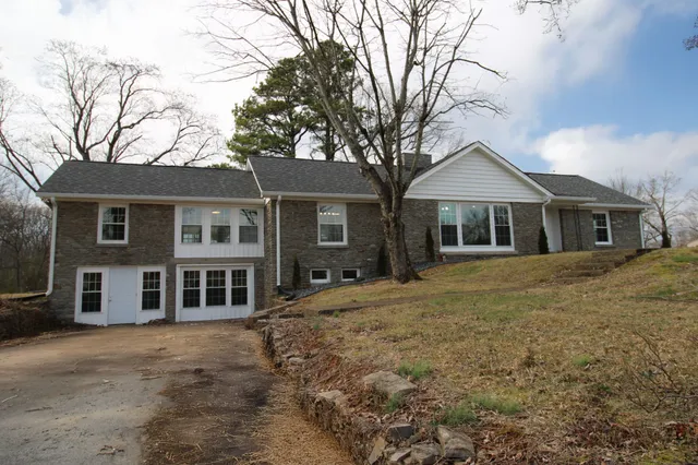 a view of a lake with houses in the back
