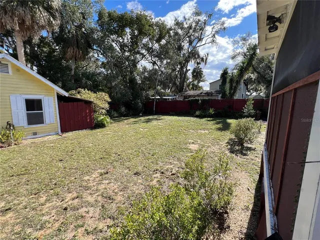 a view of a backyard of the house