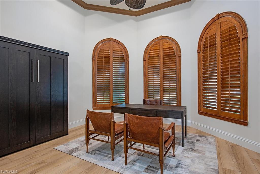 1633 China Berry Way Naples, FL 34105 - Photo 14 of 40 a view of a chairs in a room