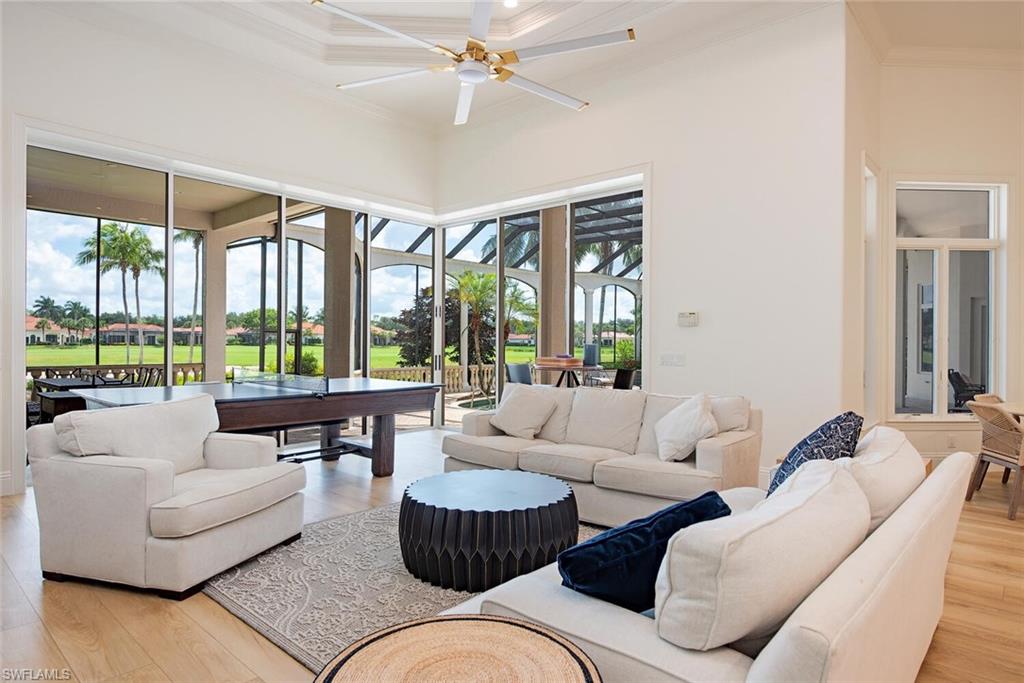 1633 China Berry Way Naples, FL 34105 - Photo 7 of 40 a living room with furniture and a large window