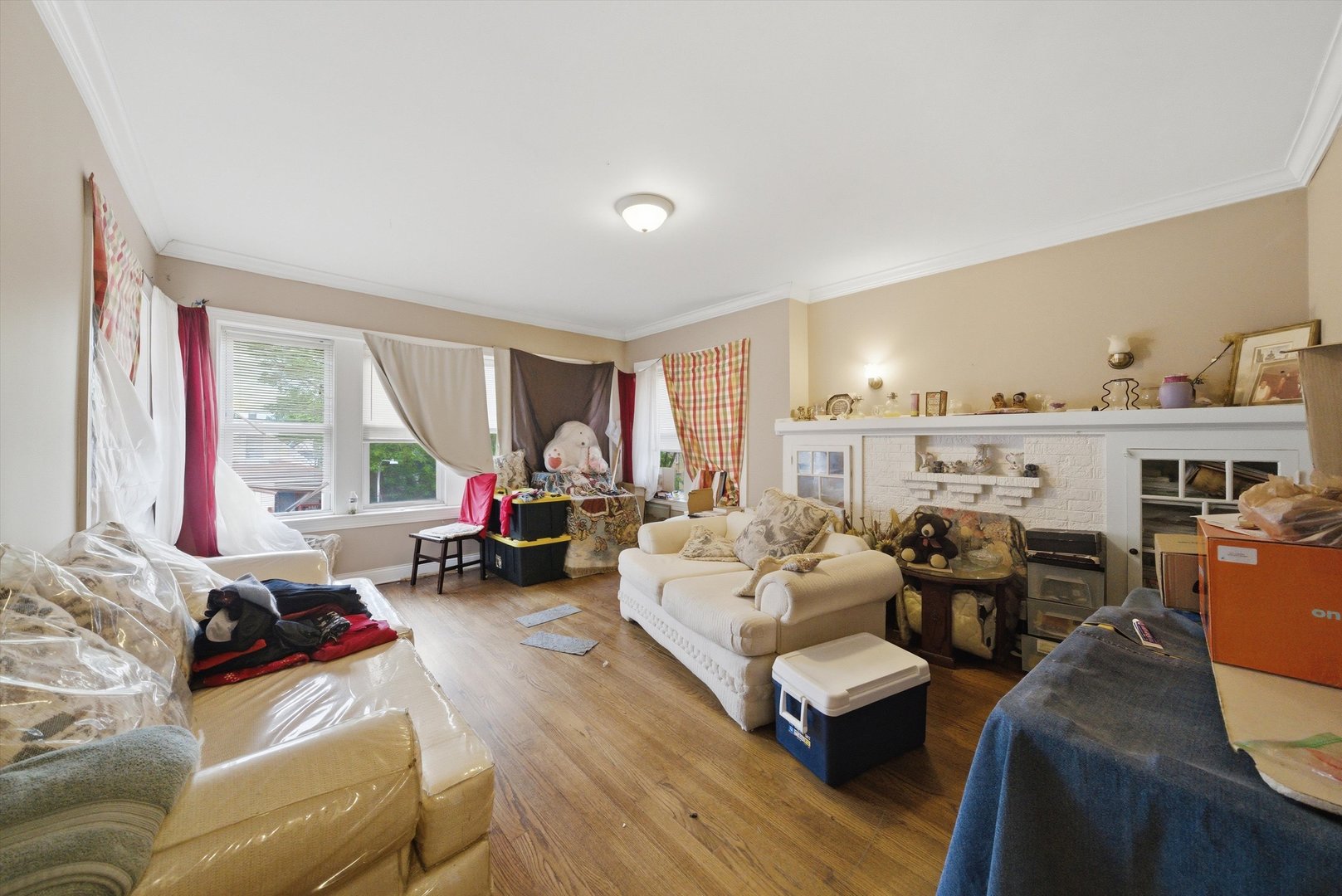 6837 South Morgan Street Chicago, IL 60621 - Photo 3 of 24 a living room with furniture and a large window