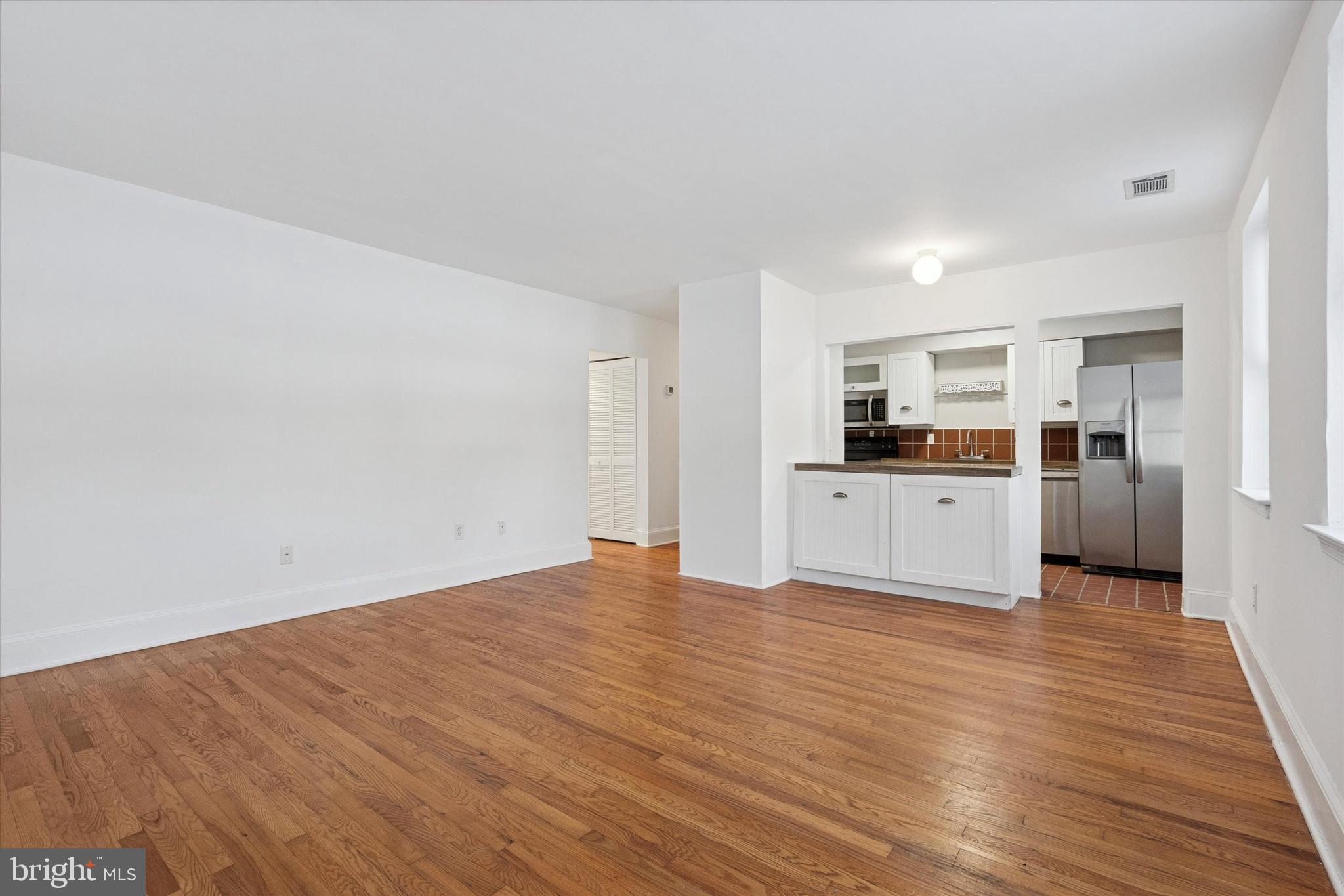 42 Conshohocken State Road, Unit 7B Bala Cynwyd, PA 19004 - Photo 5 of 13 a view of a kitchen with wooden floor and electronic appliances