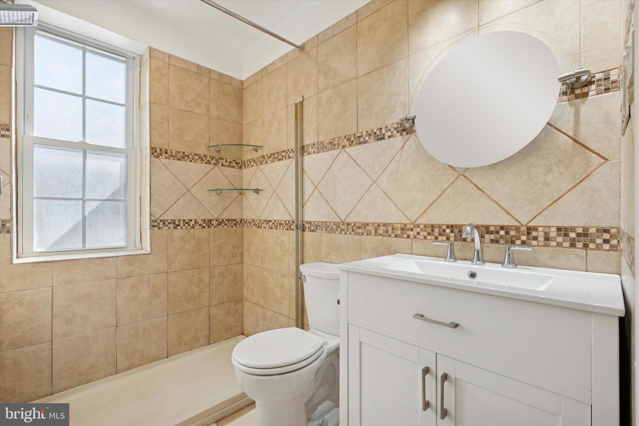 42 Conshohocken State Road, Unit 7B Bala Cynwyd, PA 19004 - Photo 10 of 13 a bathroom with a sink toilet and vanity