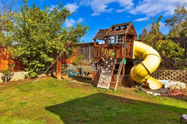 a view of a swimming pool with an outdoor space and seating area