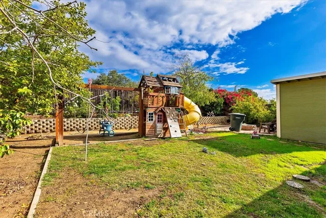 a view of a park with large trees