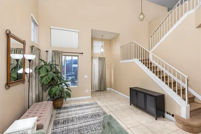 a view of an entryway with wooden floor and a potted plant